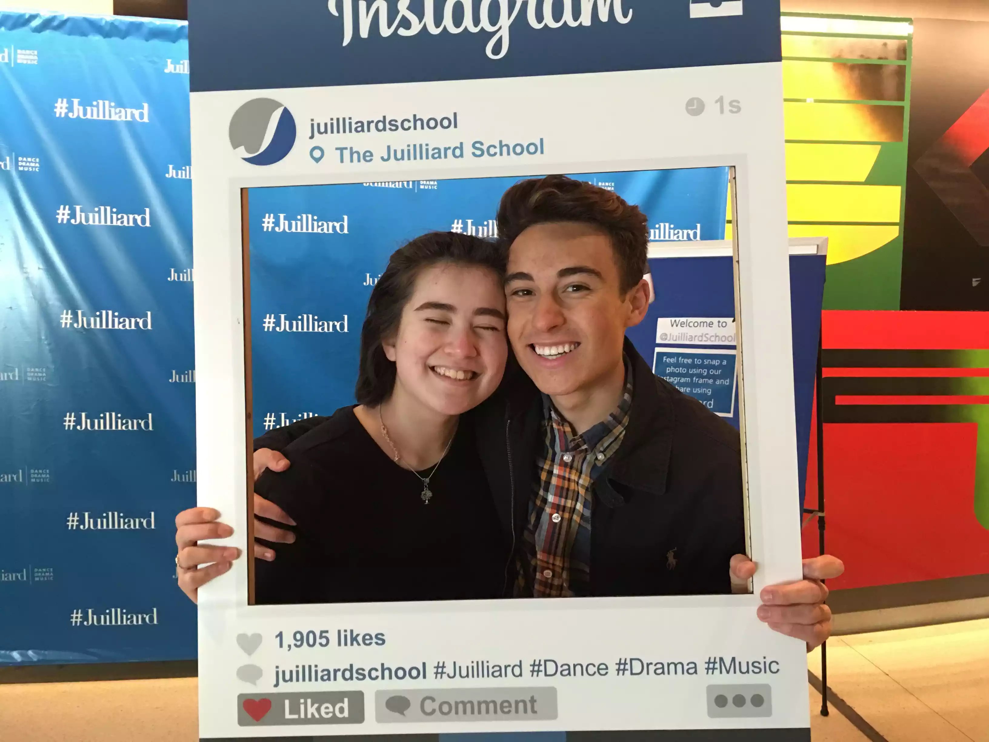 Mei and a friend pose with a Juilliard Instagram frame