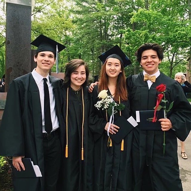 Mei and classmates in graduation caps and gowns