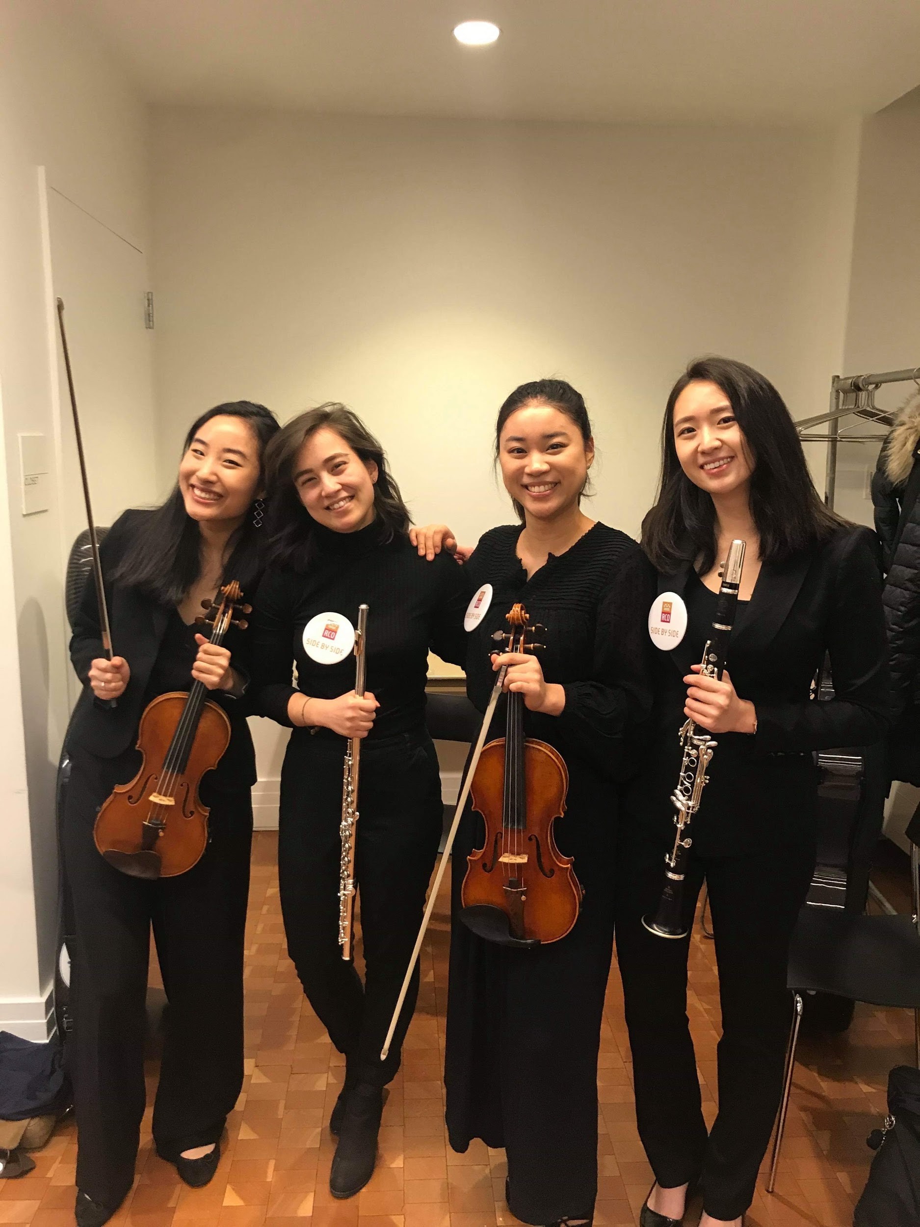 Mei poses with other musicians before a performance