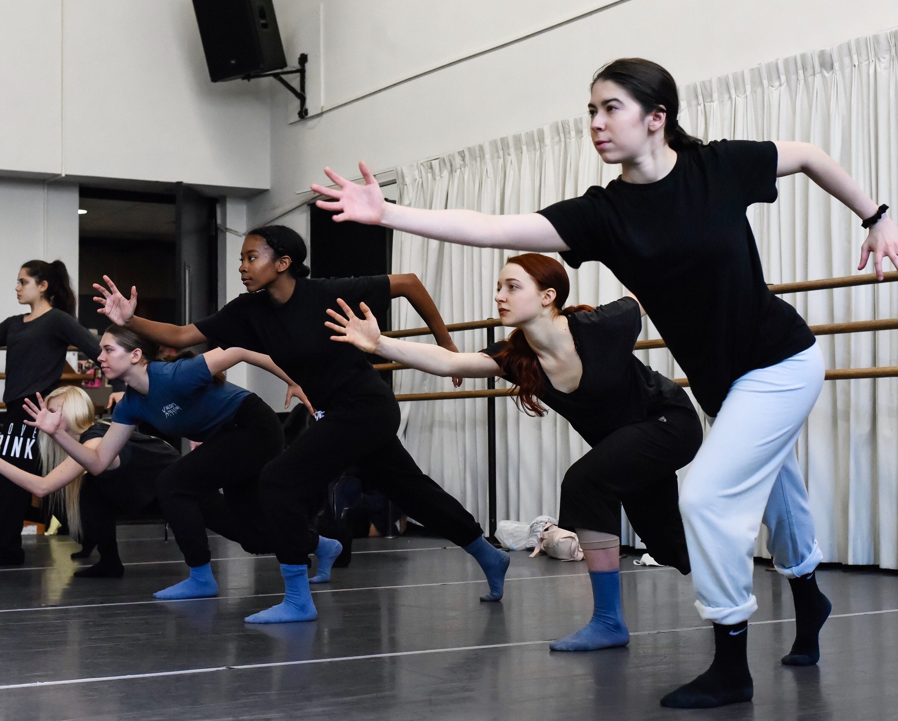 A group of dancers in a studio