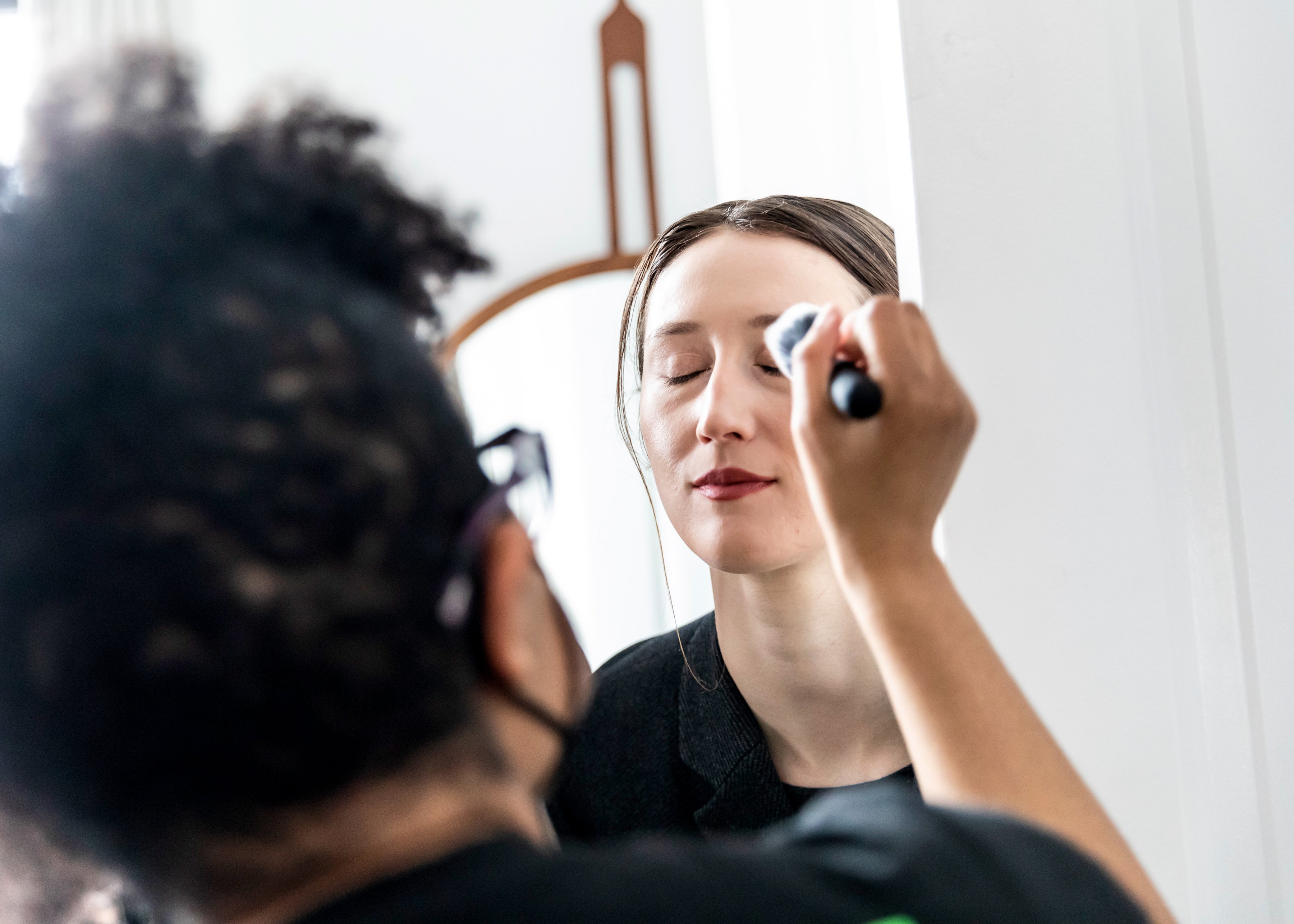 An an actor is having makeup applied