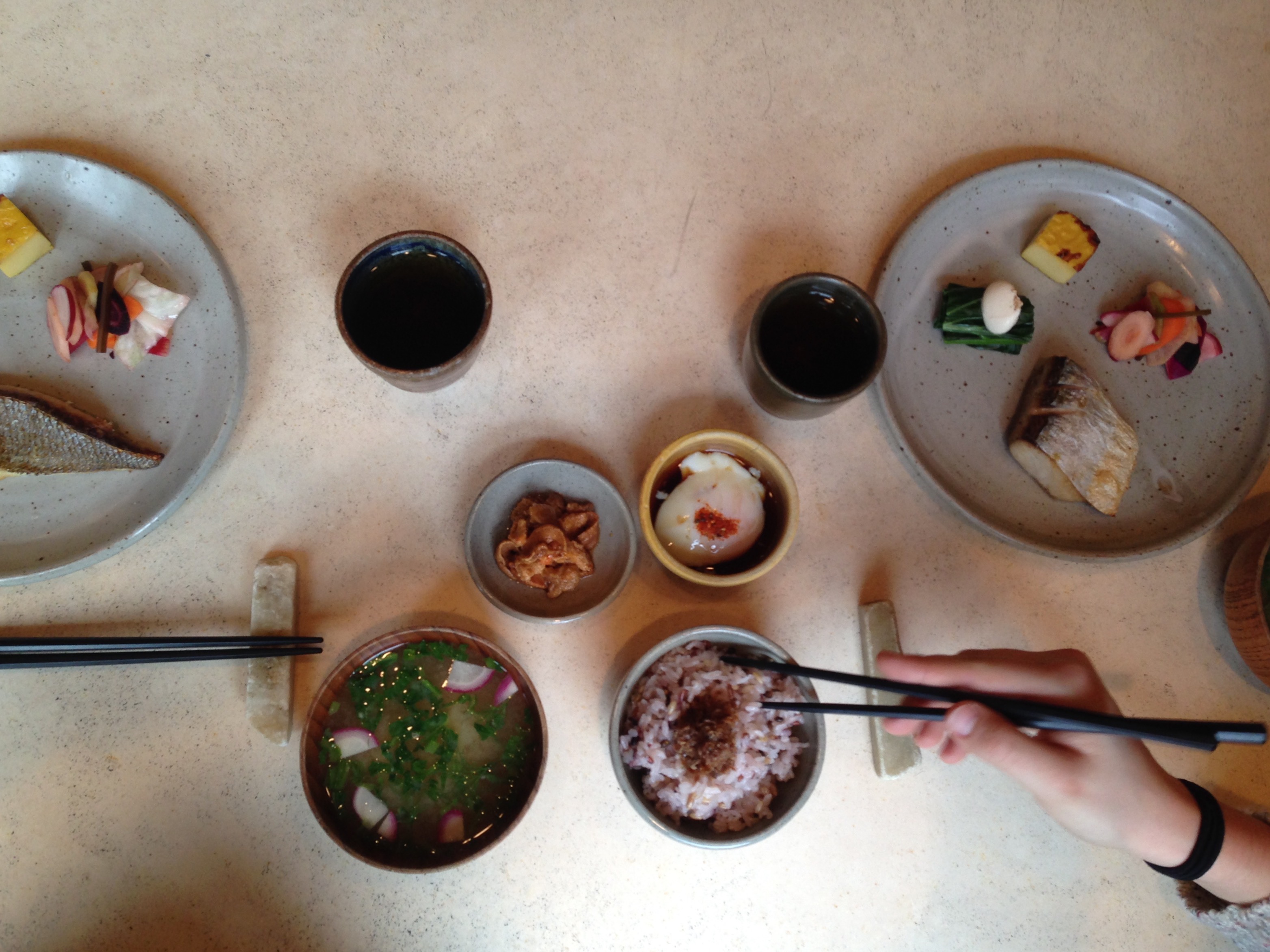 A table full of bowls of food.