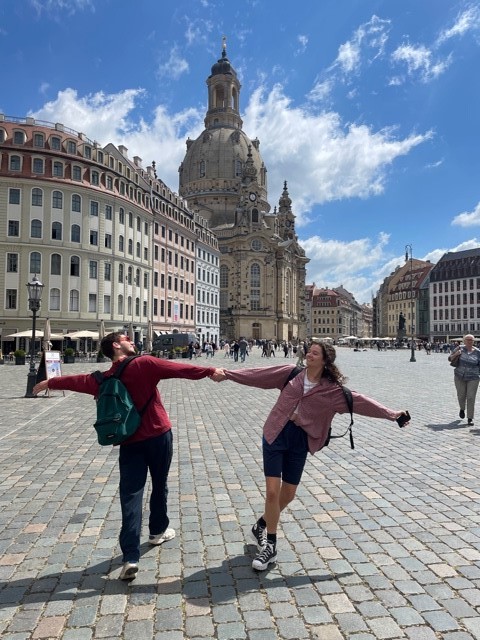 Two students posing in a European piazza