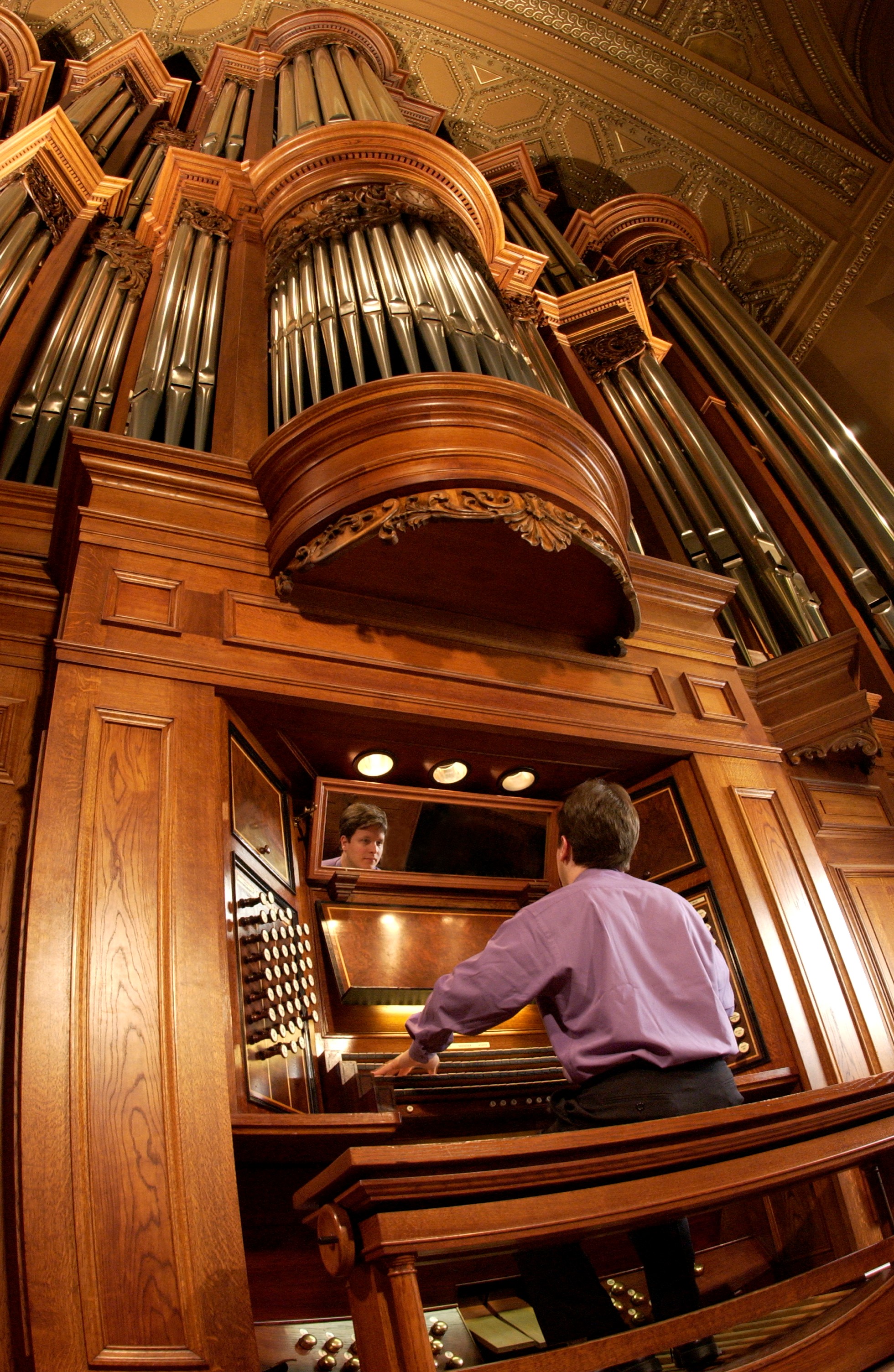Paul Jacobs is pictured seated at the organ at St. Ignatius Loyola Church