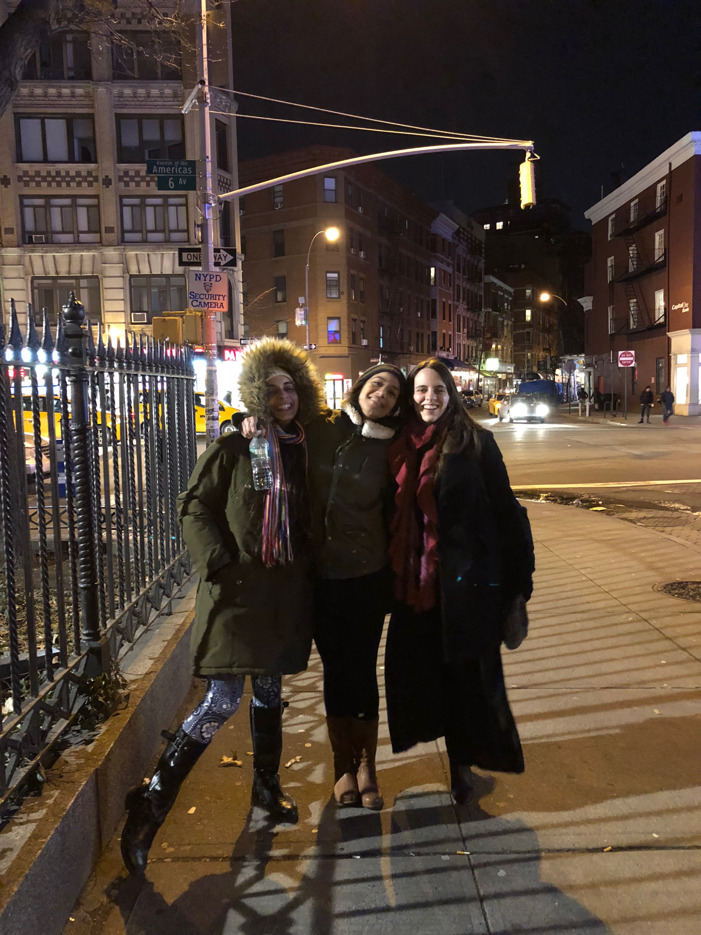 Gabriela poses with a friend on a sidewalk