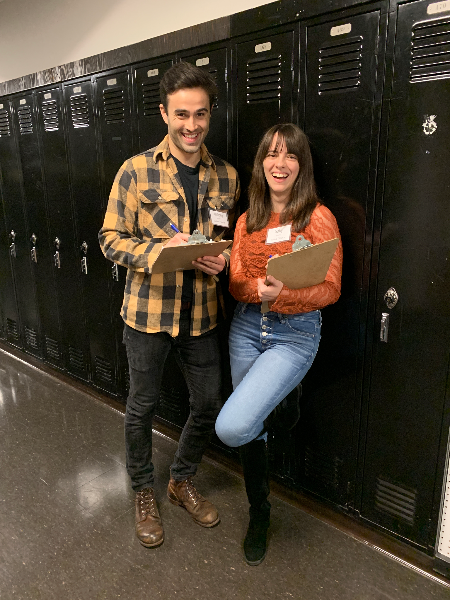 Gabriela and a friend pose in front of lockers