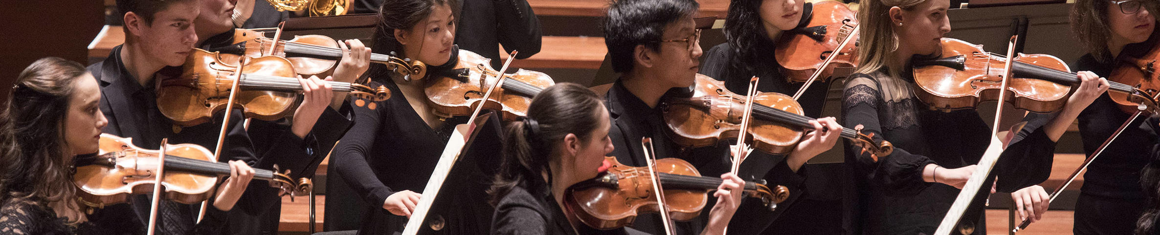 Strings and Brass playing on stage