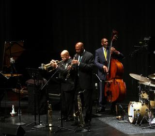 An ensemble of jazz musicians, including Frank Kimbrough at the keyboard, performing
