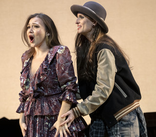 Two singers in costume in an opera performance