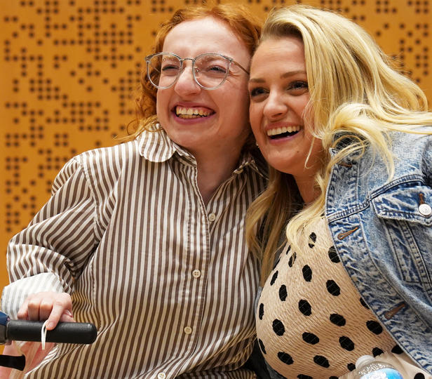 Ana Karneža and Ali Stroker leaning in and posing for a photo