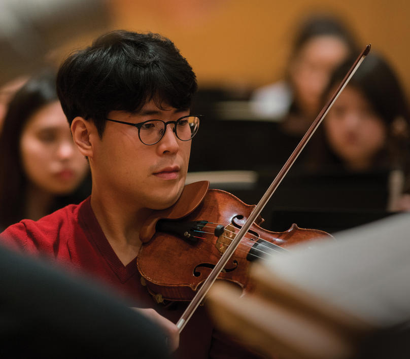 A violinist in orchestra practice