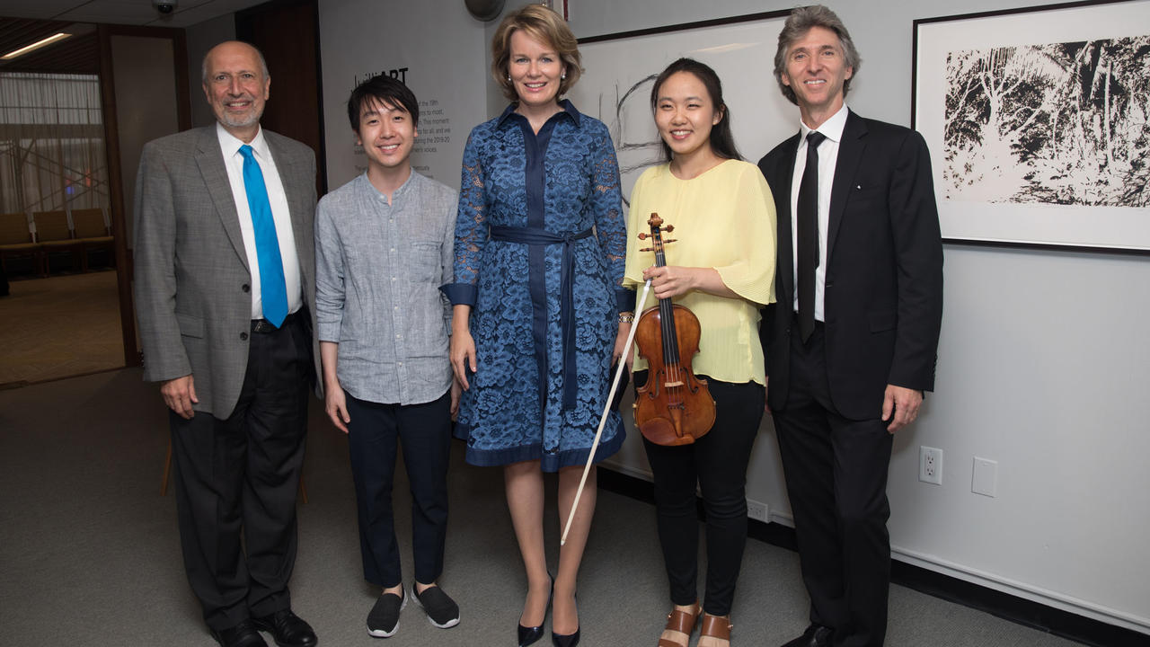 Ara Guzelimian, dean and provost; master's violinist Stephen Kim; Queen Mathilde of Belgium; doctoral candidate and violinist Stella Chen; and Damian Woetzel, president
