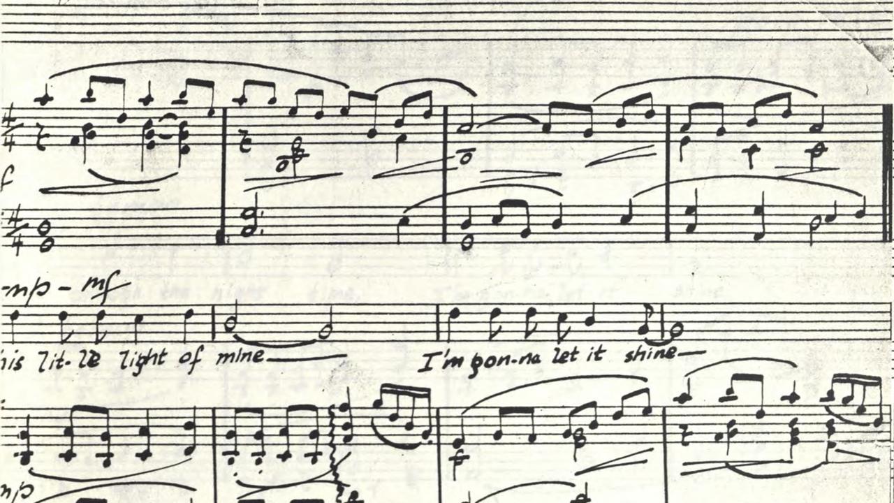 Detail of score manuscript with the lyrics visible, "...little light of mine/I'm gonna let it shine"