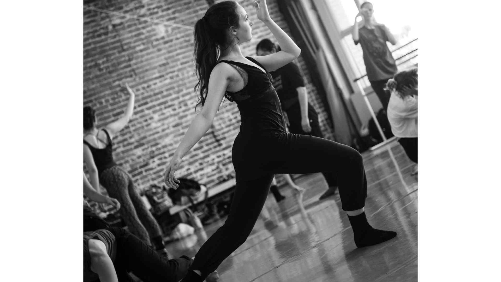 Black and white photo of Mossy rehearsing