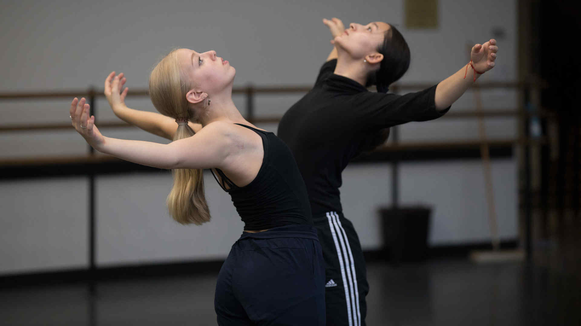 Second-year dancers Jada German and Kylie Toy dancing in a rehearsal studio