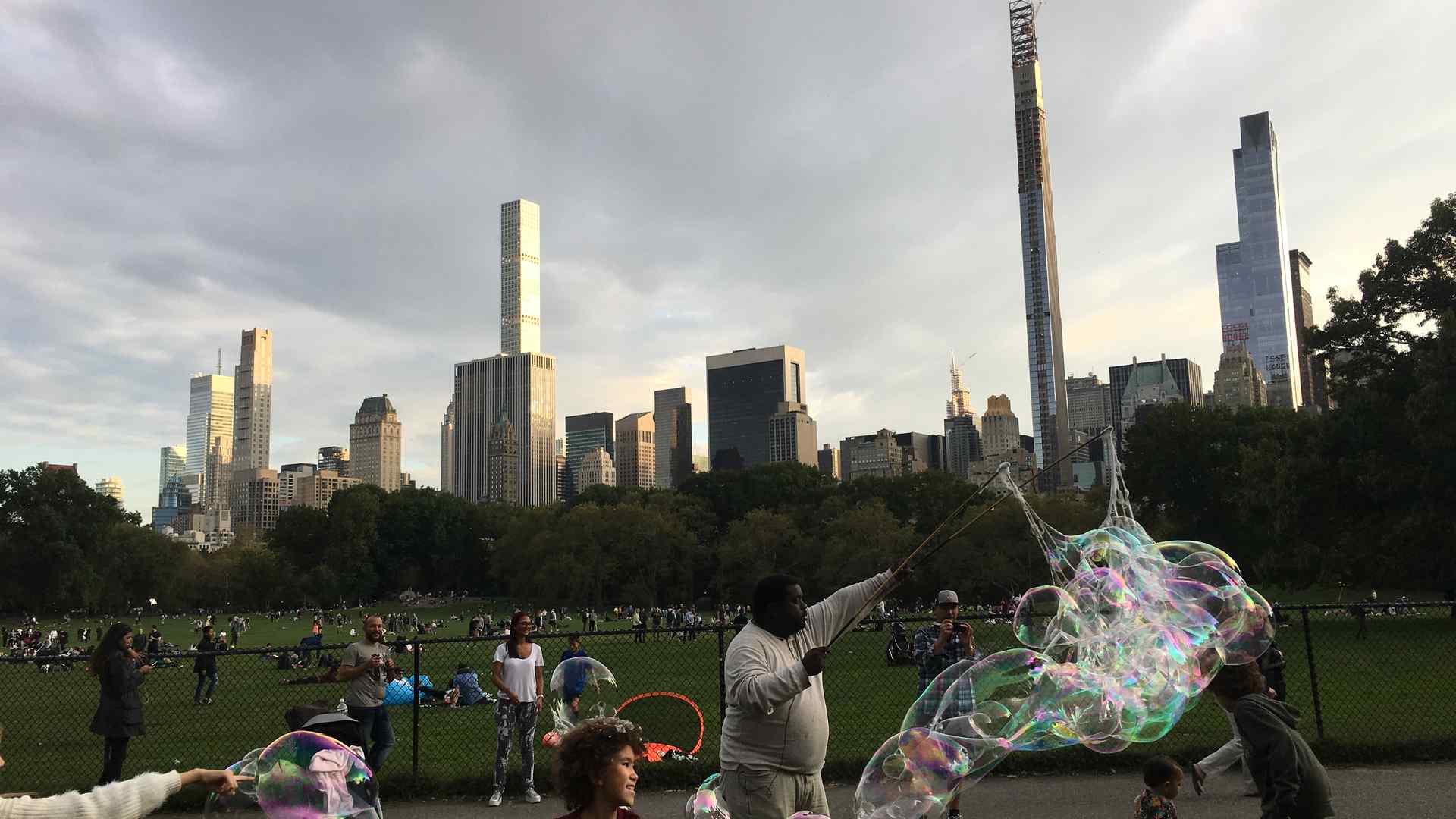 People in Central Park blow bubbles