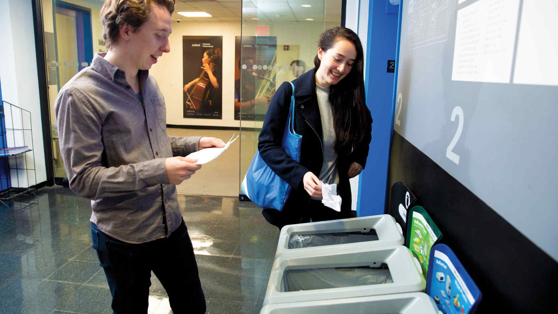 Students Ben Sellick and Isabella Bignasca near the trash and recycling bins