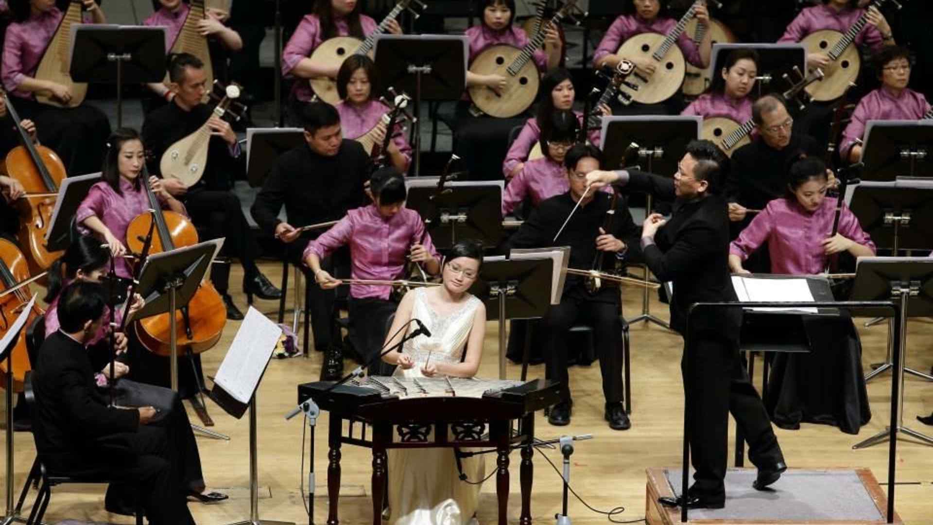 Cheng Jin performs in an orchestra