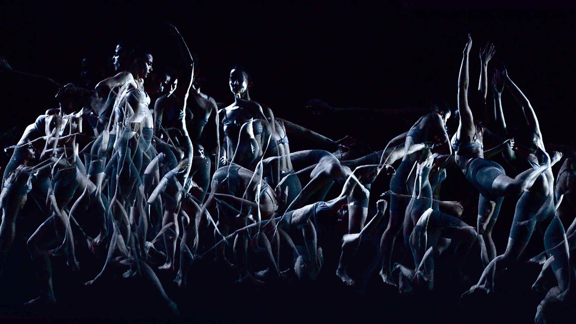 a black and white, abstract computer-generated graphic showing dancers in transparency