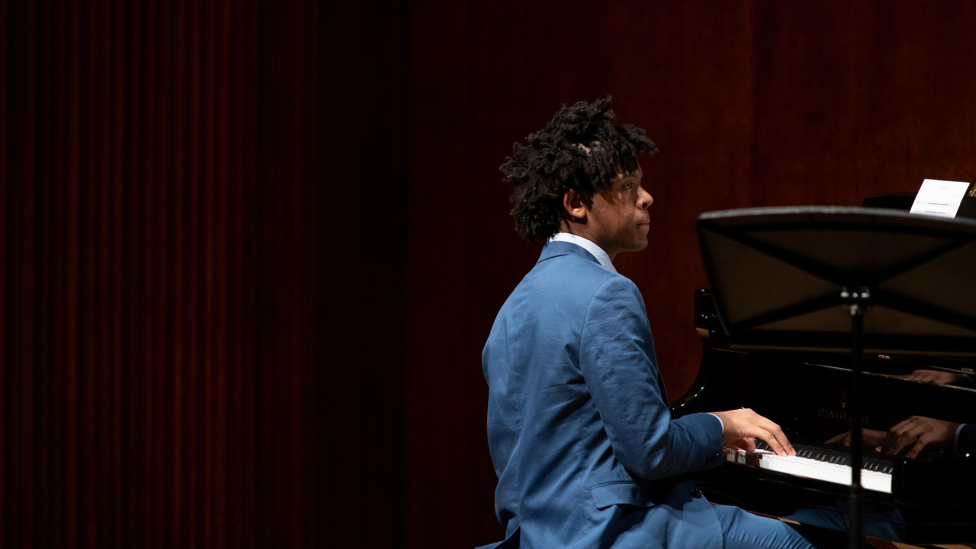 Sean Mason at the piano in the midst of a performance