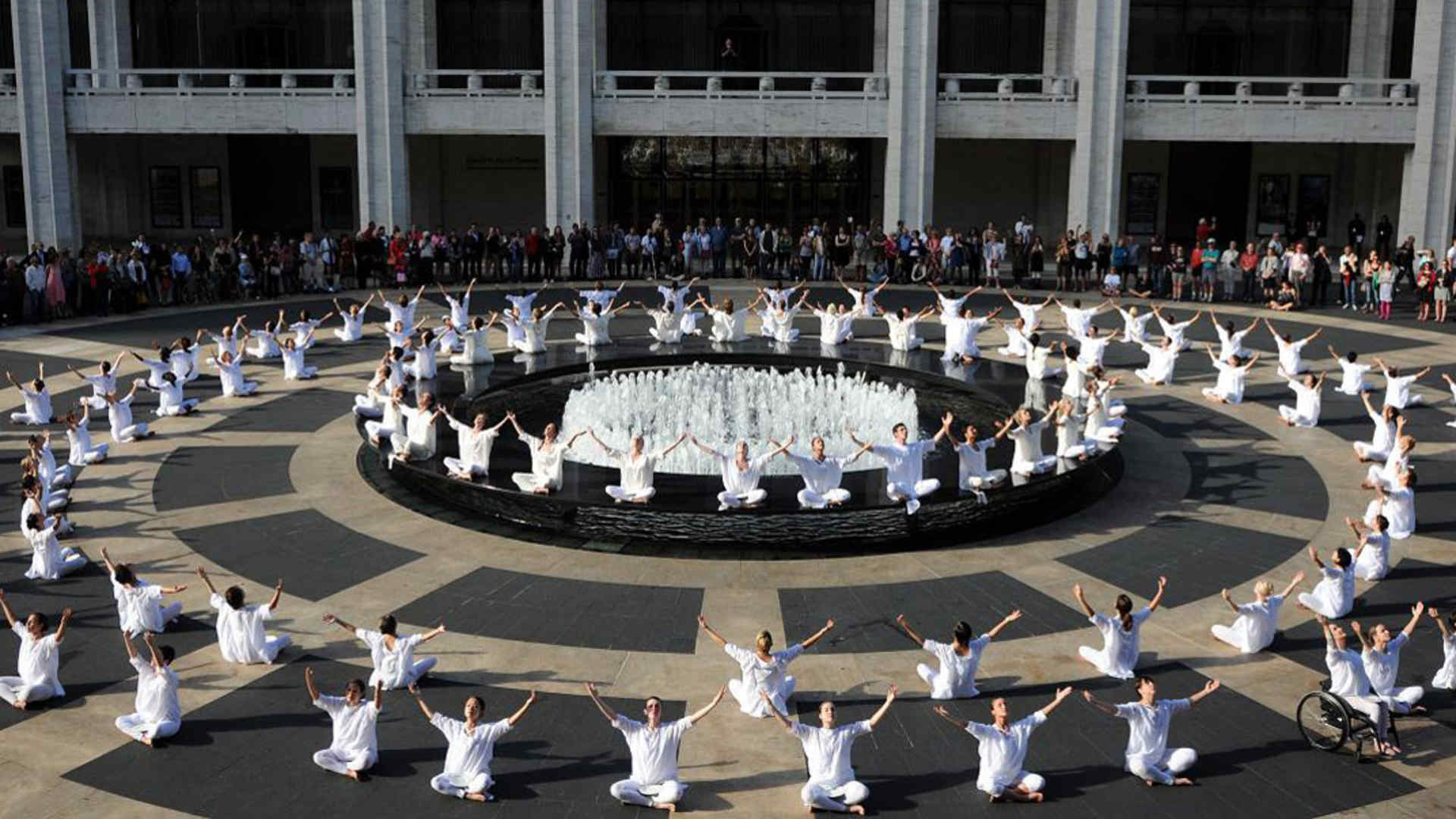 Raised arms concluding 'The Table of Silence Project'
