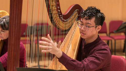 Harp player the Juilliard Orchestra during rehearsal on Monday, September 24, 2018