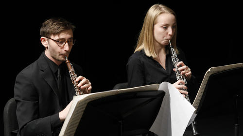 Two Oboe players performing during the Juilliard Wind Orchestra concert