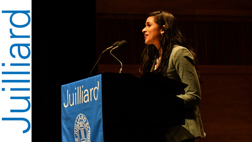 Woman speaking at a podium