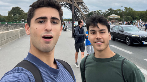 Joey Gertin and Ian Debono take a selfie in front of the Eiffel Tower