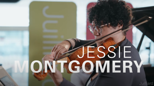 Woman with short curly hair plays violin