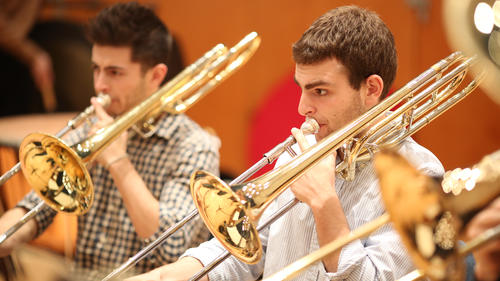 Trombone players in rehearsal