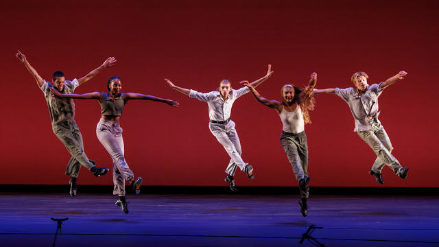 Five dancers on a stage